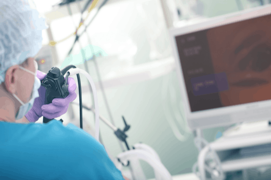 Medical Gastroenterologist performing Endoscopy Procedure with camera view