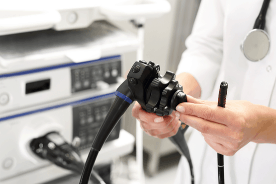 Gastroenterologist Doctor Tunning endoscope for procedure