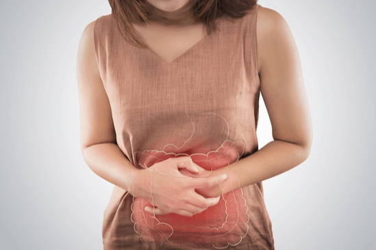 Woman holding Stomach, Digestive pains Long Island Gastroenterology